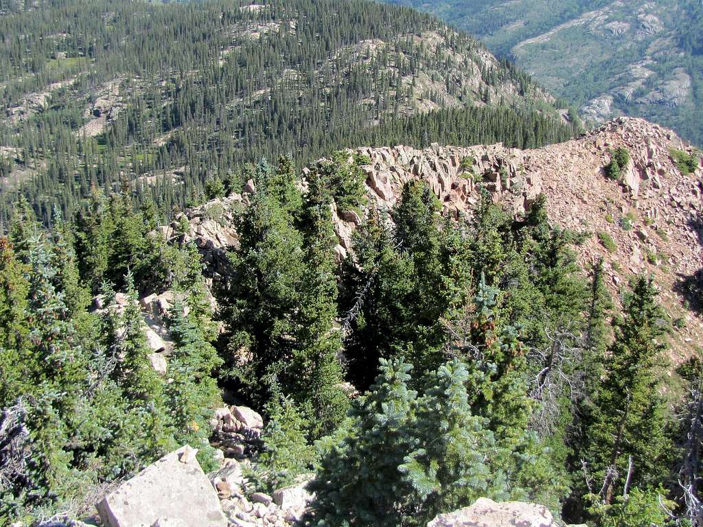 Looking back at boulder covered ridgetop to false summit