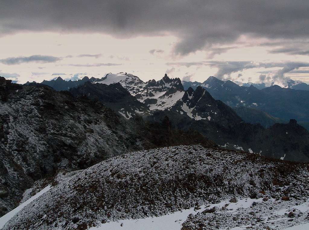 Stormy sky over Dome and Aiguille du Cian seen from Becca di Luseney