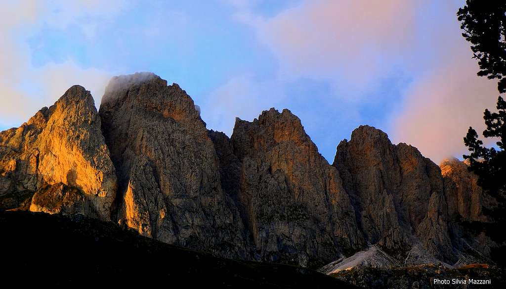 The Alpe di Cisles walls lined up at sunset