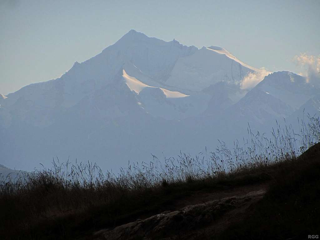 The distant, massive Weisshorn (4506m) towering over the pointy Brunegghorn (3833m)