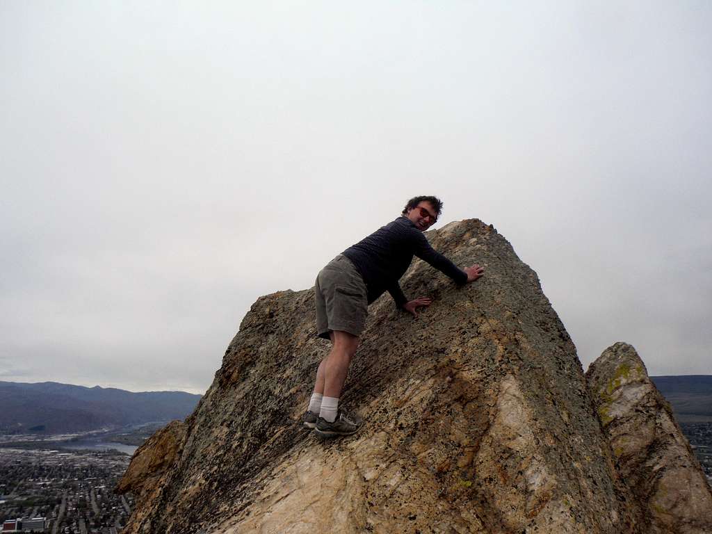 Josh Lewis tagging the summit rock