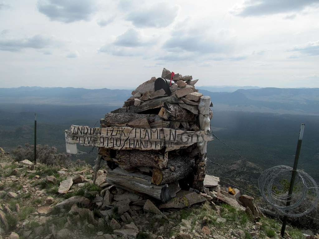 summit cairn and barbed wire