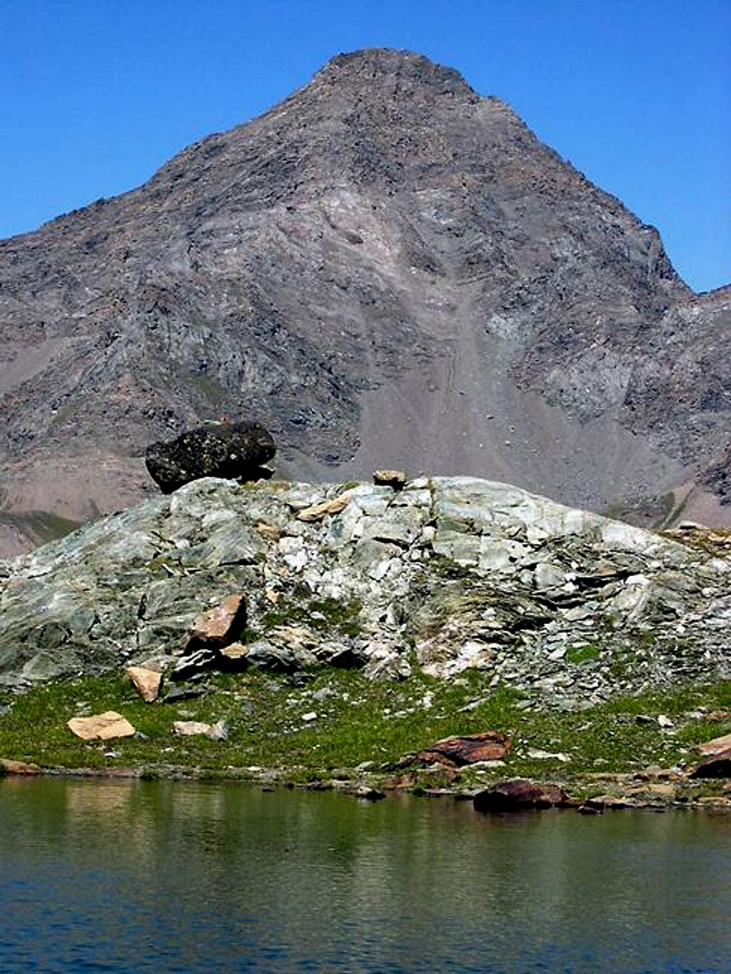 The mighty Punta Tersiva <i>3513m</i> viewed from  the shore of the Miserino lakes