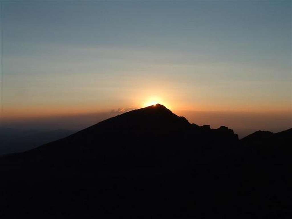 The sun rises behind Mt. Lady...