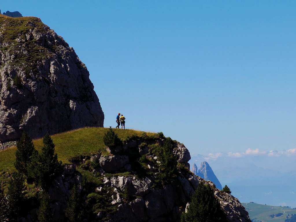 Climbers on the summit of Torre Occidentale Meisules seen from Torre Orientale