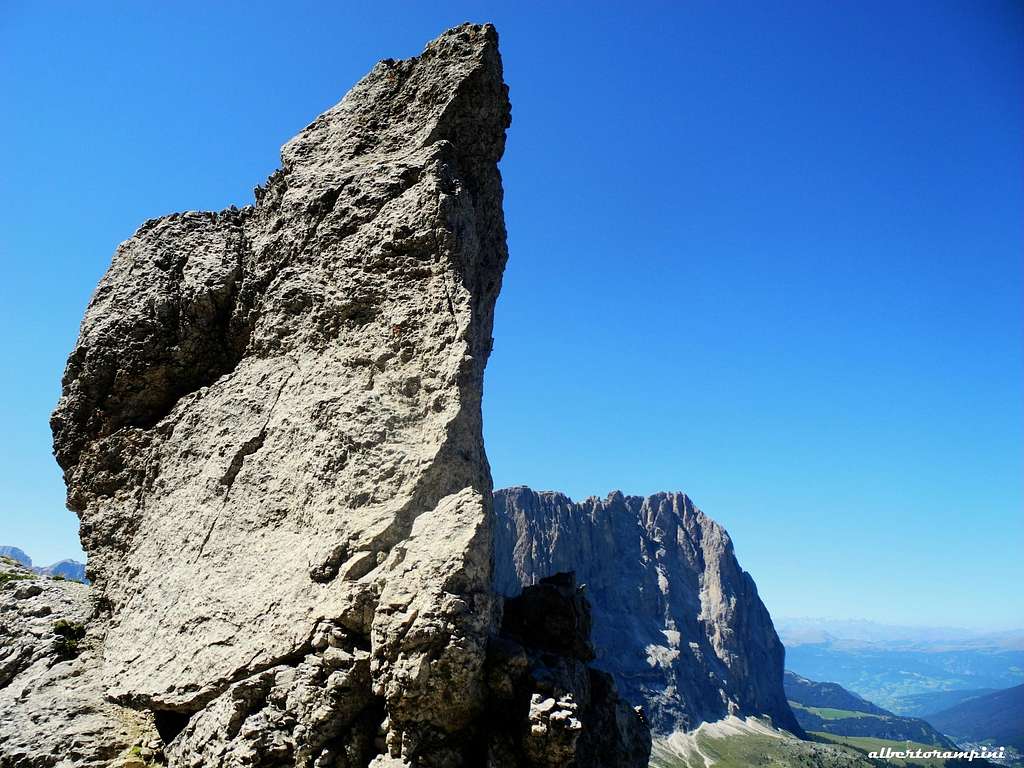 Sassolungo appears behind the summit of Fourth Sella Tower