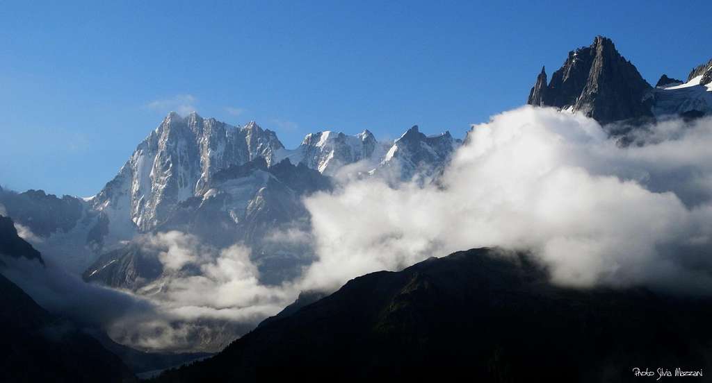 Grandes Jorasses on the left and Grands Charmoz (on the right) coming out the sea of clouds