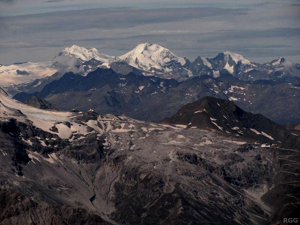 Zooming in on the distant Bernina Group from the Tschenglser Hochwand