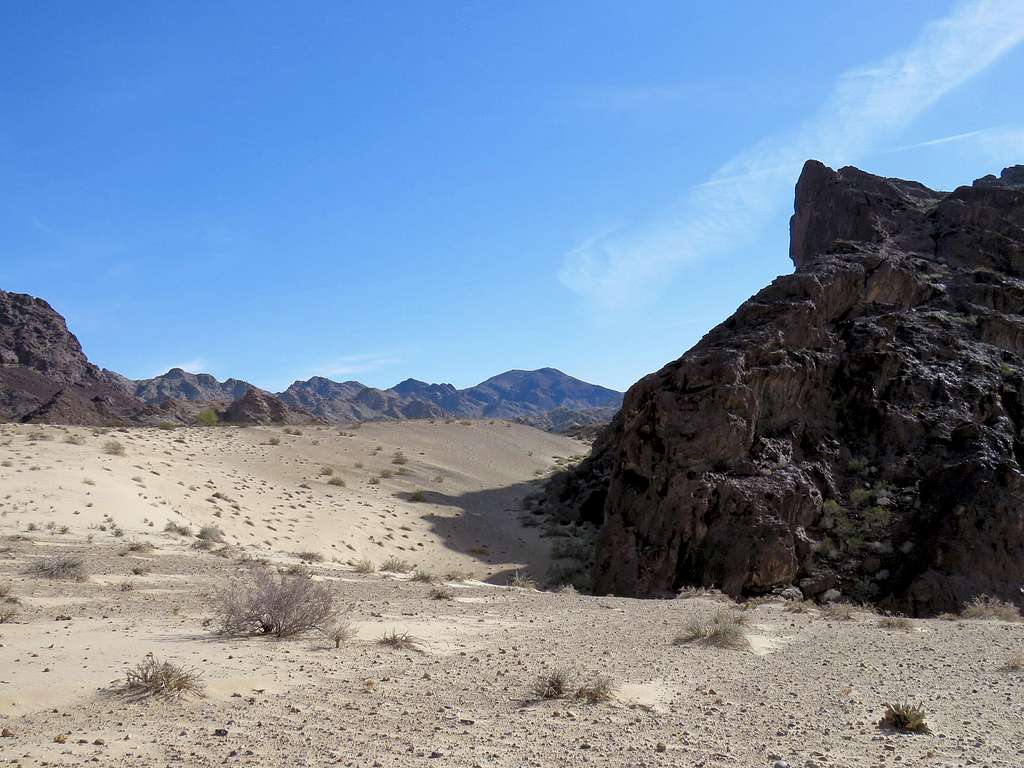 Gap between sand dunes and Peak 1144 ft