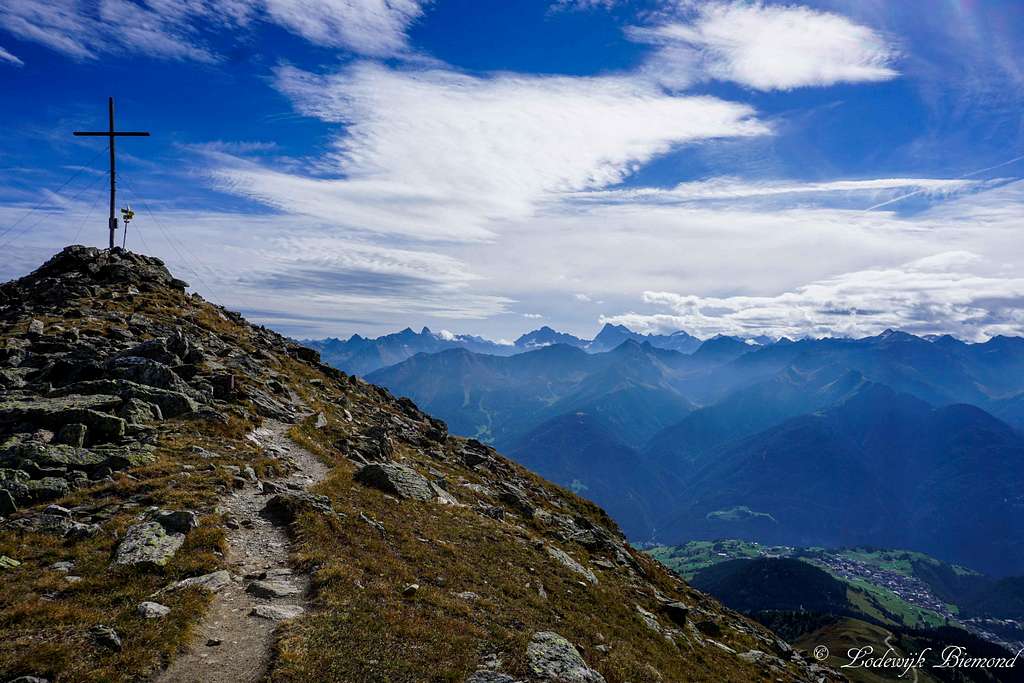 Oberer Sattelkopf Summit Cross with Watze (3534m) and Serfaus