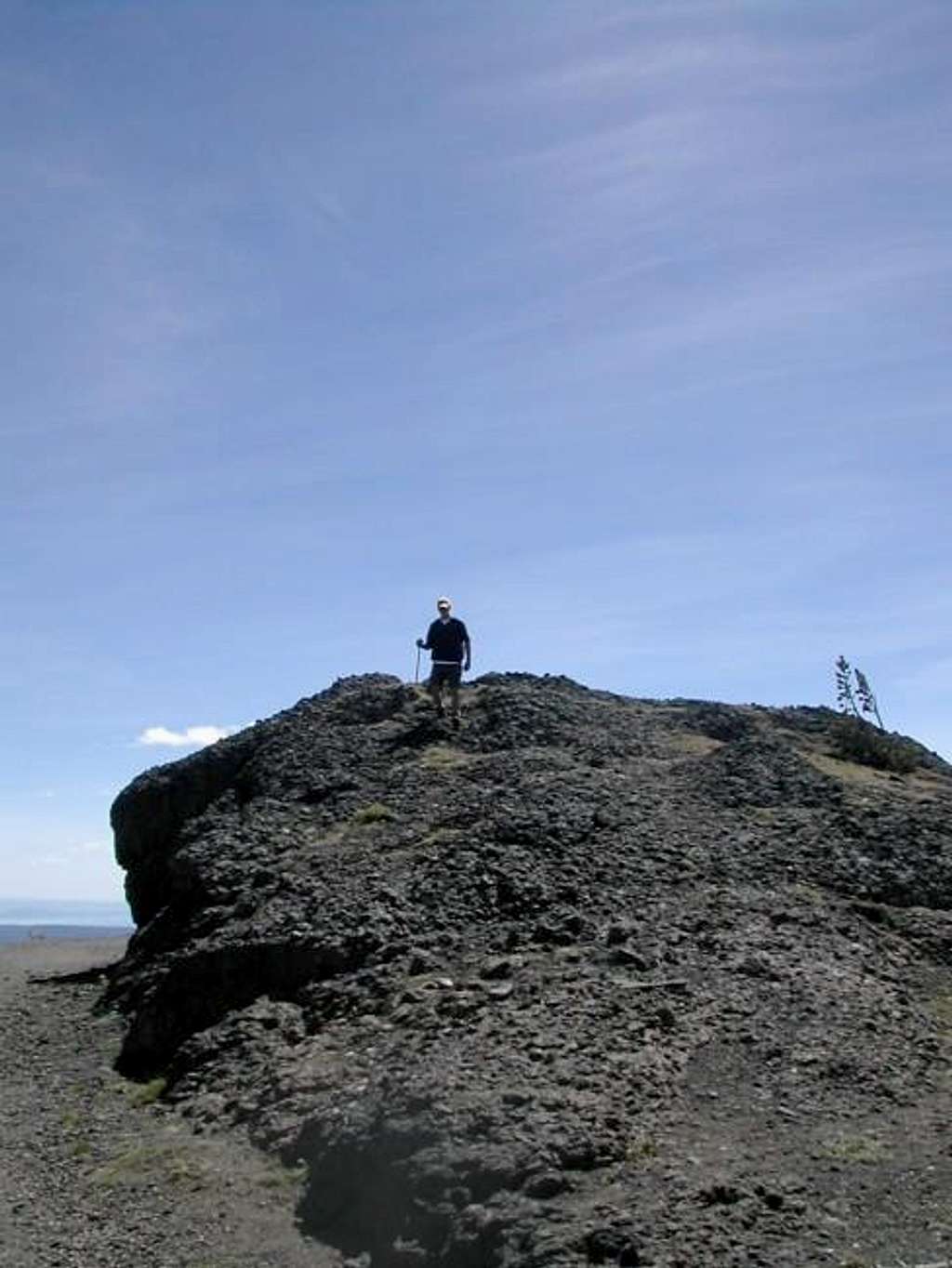My son on top of rock cliff...