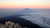 Teide shadow and island of La Palma at sunrise in december
