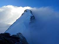 Steep snow ridge above Sattel