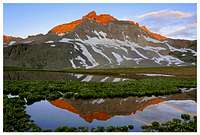 Gilpin Peak reflects an...