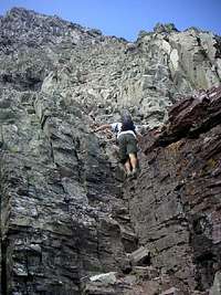 Derek Drechsel descending some 4th class rock on Pyramid Peak's Northeast Ridge/East Face Route.  July 15, 2006.