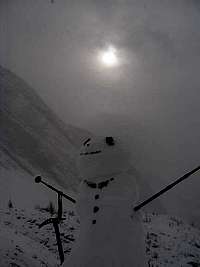 Snowman just above the lake