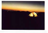 a tent at the sunset from the...
