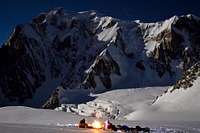Priming the stove below the South Face/ Brenva face of the Mont Blanc under the full moon