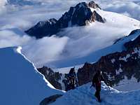A team of three ascending the summit ridge of Aiguille d'Argentiere