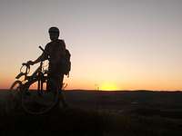 With bike at 390m at an sunset