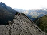 Traversing an exposed ridge, Mt Barff ascent