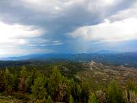 A thunderstorm obscures the view of Kern Peak from the tower