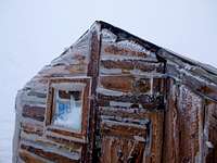 Hut during the storm. The window had been broken by flying pebbles, picked up by very strong wind.