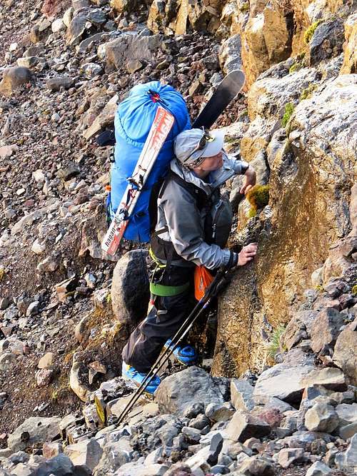 Jan looks for a handhold while scrambling up the gully