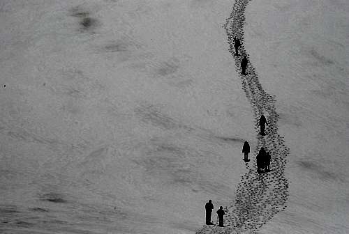 Close-up of people walking on glacier...