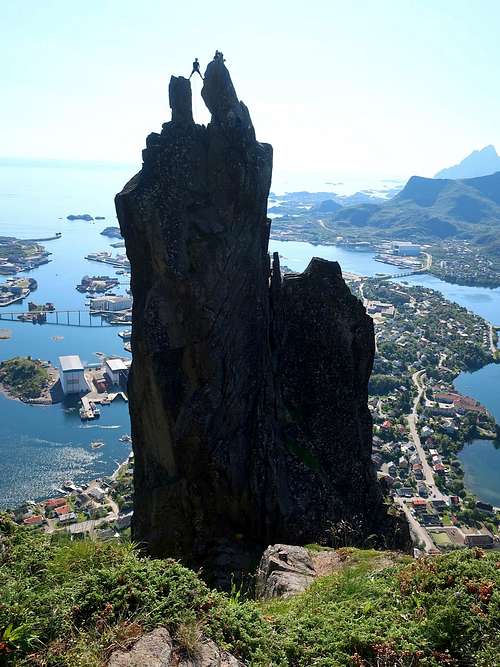 A climber on the spectacular summit of Svolvaergeita