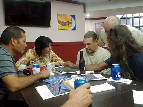 Meeting with the boat captain to discuss landing sites