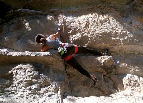 Erica Works the Crux of Magster (5.10a)