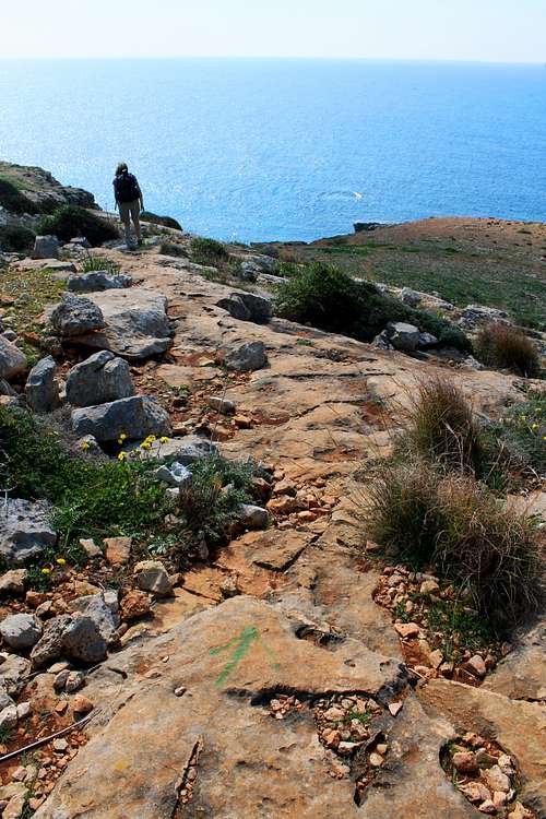 Hiking Malta's coastal paths, often the only guidance is a painted arrow!