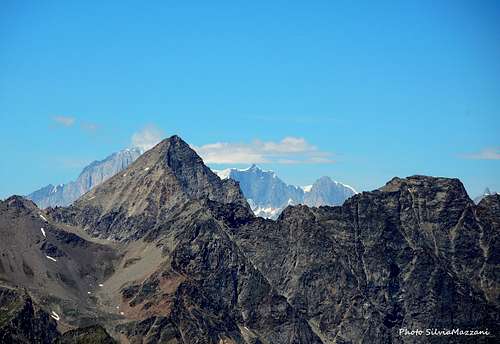 Top of Monte Bianco partially covered by Mont Emilius seen from Mont Glacier