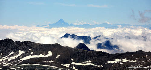 From Mont Glacier view to the Monviso pyramid at great distance