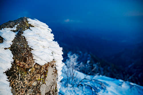 Windblown snow formations on rocks