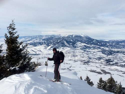 JD Sacklin on the summit of Little Ellis, with the Bridger Range in the background