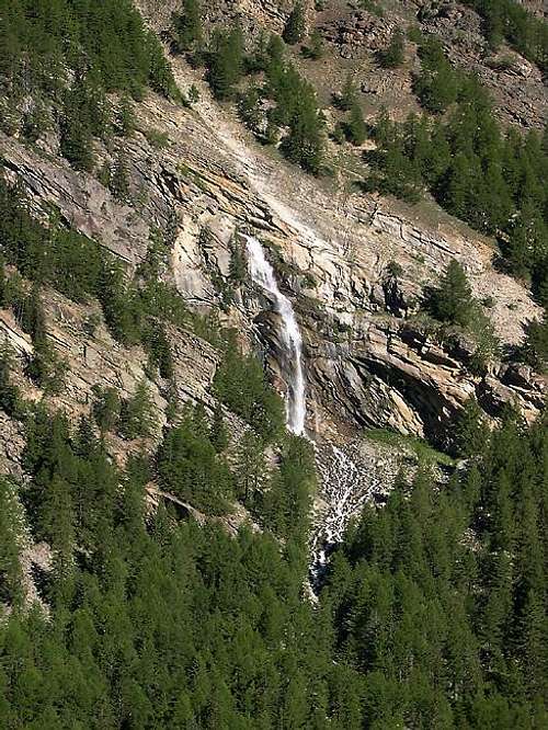 Waterfall formed by Gran Lauson creek seen climbing towards Pian Tournetta <i>2418m</i>