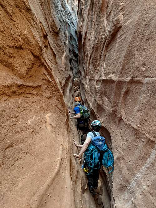 Hikers in one of the deep narrow sections of Egypt Two Canyon