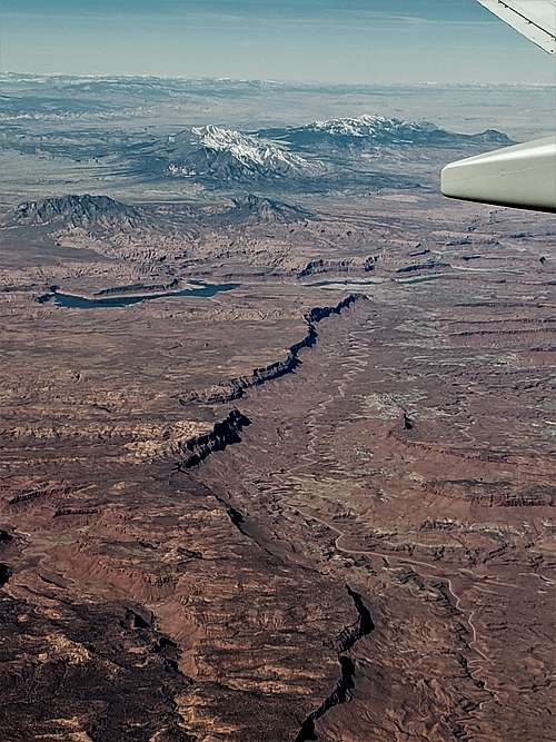 Red Canyon, Mt. Ellen Peak and Mt. Pennell of Henry Mountains plus Lake Powell