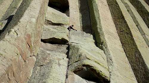 I5. A climber negotiates the second of four overhangs on the aesthetic McCarthy West Face of Devils Tower