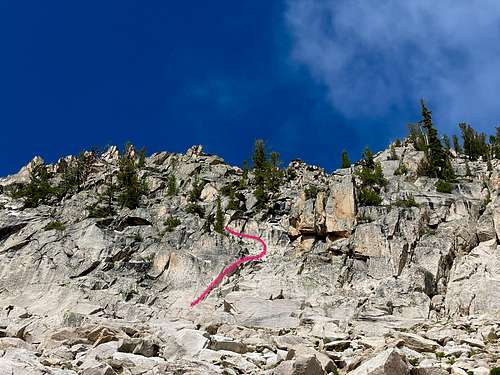 The base of the climb. There is a hand crack at the pink line. 5.1'ish. Then a ramp up and left.