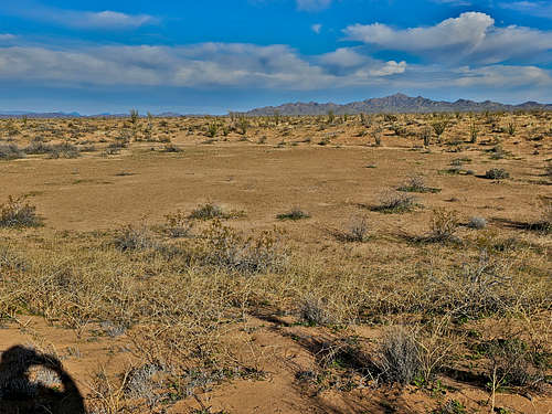 Basin among sand dunes, Planet Peak seen
