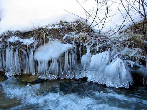 Frozen water of a stream, on...