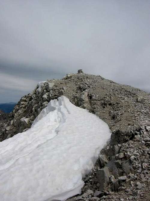 A small cairn marks the...