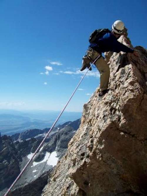 Kelby Fischer climbing (or...
