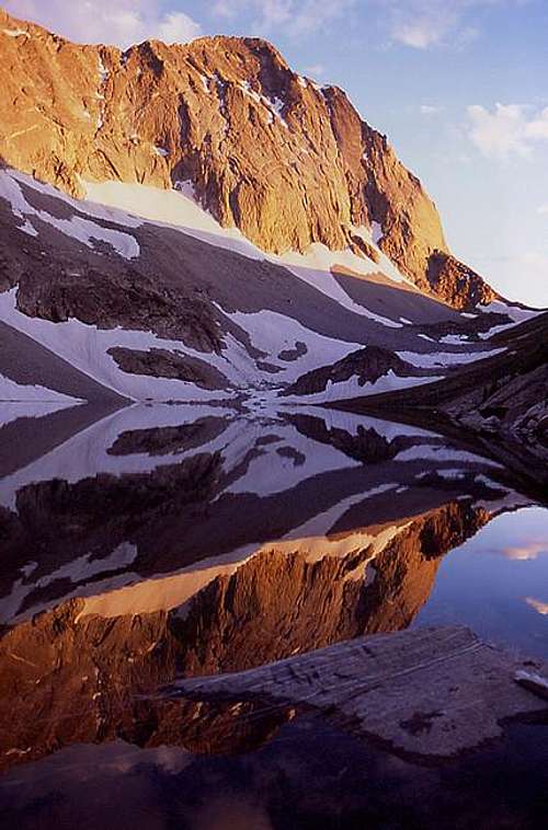 Capitol Peak watches as the...