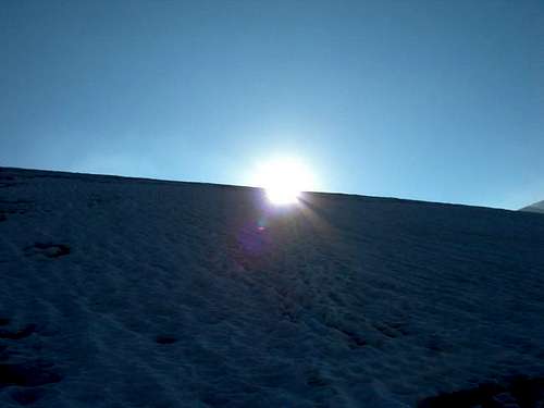 The sun arises from the snow