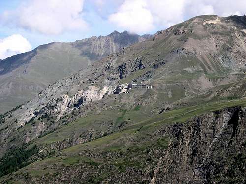 The buildings of the disused Colonna Mine <i>2387m</i> on the slope of Montzalet <i>2759m</i>