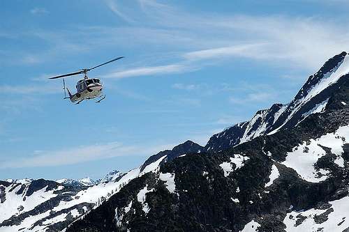 Helicopter bringing in supplies to the Conrad Kain Hut, Bugaboo Mountains